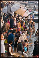 Colorful crowd at the edge of water, Dasaswamedh Ghat. Varanasi, Uttar Pradesh, India (color)