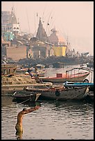 Man with arms stretched standing in Ganga River. Varanasi, Uttar Pradesh, India