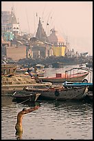 Man with arms stretched standing in Ganga River. Varanasi, Uttar Pradesh, India (color)