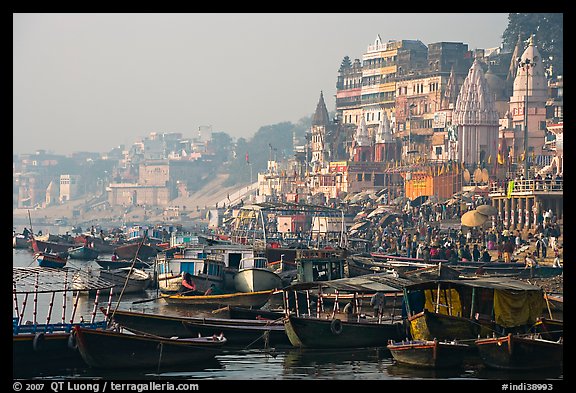 Boats and temples of Dasaswamedh Ghat, sunrise. Varanasi, Uttar Pradesh, India