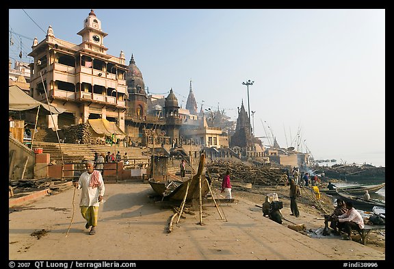 Manikarnika Ghat, with piles of wood used for cremation. Varanasi, Uttar Pradesh, India (color)