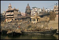 Huge piles of firewood stacked at Manikarnika Ghat. Varanasi, Uttar Pradesh, India (color)