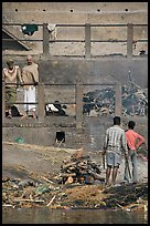 Men attending to cremation, Manikarnika Ghat. Varanasi, Uttar Pradesh, India (color)