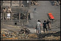 Cremation in progress, with another corpse awaiting, Manikarnika Ghat. Varanasi, Uttar Pradesh, India (color)