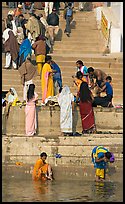 Women rinsing in river Ganges water. Varanasi, Uttar Pradesh, India