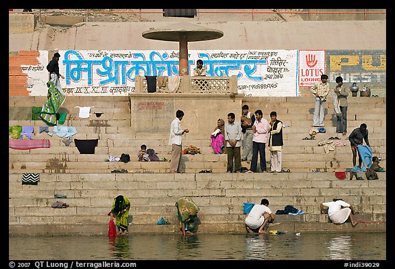 People washing cloths, steps, and Indi inscriptions. Varanasi, Uttar Pradesh, India