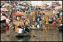 Boats and stone steps leading to Ganga River, Dasaswamedh Ghat. Varanasi, Uttar Pradesh, India (color)