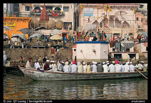 Boat packed with men near Dasaswamedh Ghat. Varanasi, Uttar Pradesh, India (color)