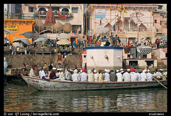 Boat packed with men near Dasaswamedh Ghat. Varanasi, Uttar Pradesh, India