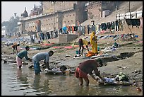 Men washing laundry on Ganga riverbanks. Varanasi, Uttar Pradesh, India (color)