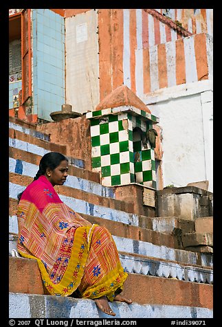 Woman sitting on temple steps. Varanasi, Uttar Pradesh, India (color)