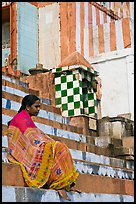 Woman sitting on temple steps. Varanasi, Uttar Pradesh, India ( color)