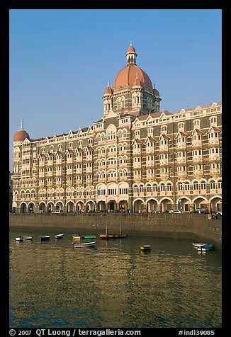 Taj Mahal Palace Hotel and small boats in harbor. Mumbai, Maharashtra, India (color)