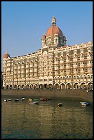 Taj Mahal Palace Hotel and small boats in harbor. Mumbai, Maharashtra, India (color)