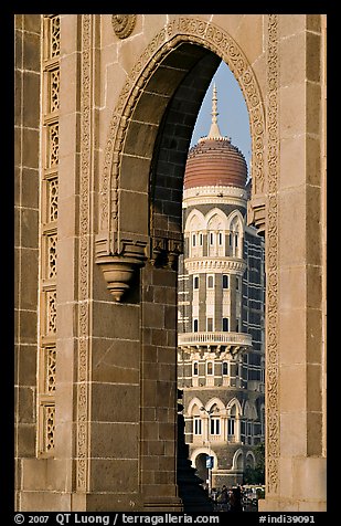 Taj Mahal Palace Hotel seen through arch of Gateway of India. Mumbai, Maharashtra, India (color)
