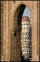 Taj Mahal Palace Hotel seen through arch of Gateway of India. Mumbai, Maharashtra, India (color)