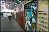 View of departing train with motion blur. Mumbai, Maharashtra, India ( color)