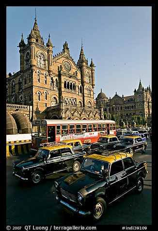 Black and Yellow cabs in front of Victoria Terminus. Mumbai, Maharashtra, India (color)