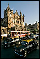 Black and Yellow cabs in front of Victoria Terminus. Mumbai, Maharashtra, India (color)