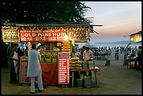 Food kiosks at sunset, Chowpatty Beach. Mumbai, Maharashtra, India (color)