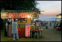 Food kiosks at sunset, Chowpatty Beach. Mumbai, Maharashtra, India