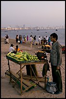 Food vendor on beach at dusk, Chowpatty Beach. Mumbai, Maharashtra, India