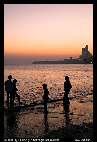 Beachgoers and skyline, Chowpatty Beach. Mumbai, Maharashtra, India (color)