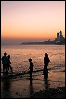 Beachgoers and skyline, Chowpatty Beach. Mumbai, Maharashtra, India (color)