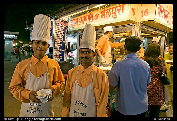 Cooks in front of Panipuri stall, Chowpatty Beach. Mumbai, Maharashtra, India