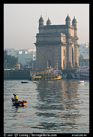 Small boat and Gateway of India, early morning. Mumbai, Maharashtra, India (color)