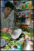 Street vendor preparing a snack with leaves. Mumbai, Maharashtra, India