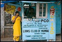 Woman at a street telephone booth. Mumbai, Maharashtra, India ( color)