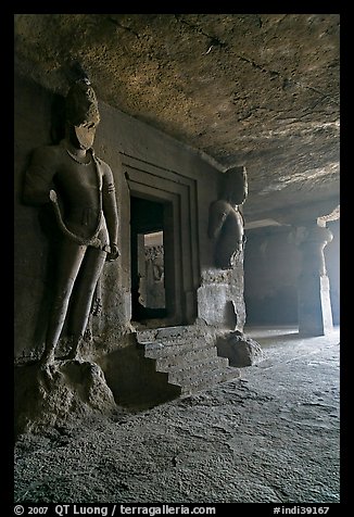 Figures of Dwarpala on Shiva shrine, Elephanta caves. Mumbai, Maharashtra, India (color)