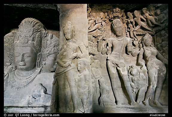 Mahesh Murti and Gangadhara Siva carved in rock, main  Elephanta cave. Mumbai, Maharashtra, India (color)