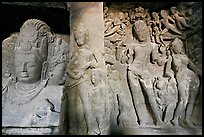 Mahesh Murti and Gangadhara Siva carved in rock, main  Elephanta cave. Mumbai, Maharashtra, India (color)