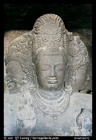 Triple-headed Shiva sculpture, Elephanta caves. Mumbai, Maharashtra, India (color)