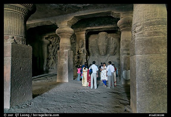 Vistors in main cave, Elephanta Island. Mumbai, Maharashtra, India