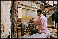 Man weaving a carpet. Agra, Uttar Pradesh, India (color)