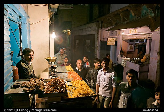 Street with vendor of sweets by night, Taj Ganj. Agra, Uttar Pradesh, India (color)