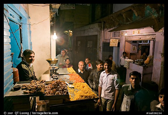 Street with vendor of sweets by night, Taj Ganj. Agra, Uttar Pradesh, India