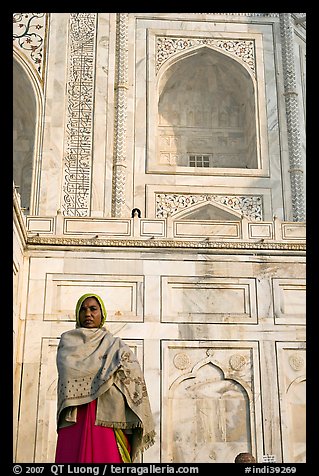 Woman standing at the base of Taj Mahal. Agra, Uttar Pradesh, India (color)