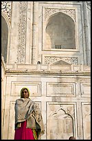Woman standing at the base of Taj Mahal. Agra, Uttar Pradesh, India (color)