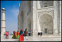 Base of Taj Mahal, minaret, and tourists. Agra, Uttar Pradesh, India