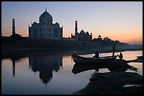 Boat on Yamuna River in front of Taj Mahal, sunset. Agra, Uttar Pradesh, India (color)