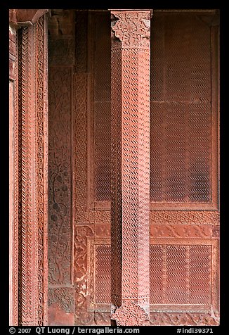 Carved columns and wall of the Rumi Sultana building. Fatehpur Sikri, Uttar Pradesh, India