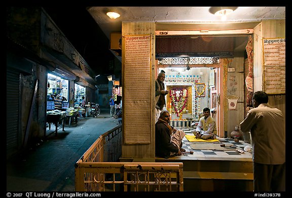 Hindu temple at street corner by night. Bharatpur, Rajasthan, India (color)