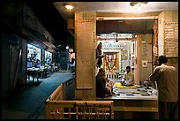 Hindu temple at street corner by night. Bharatpur, Rajasthan, India (color)