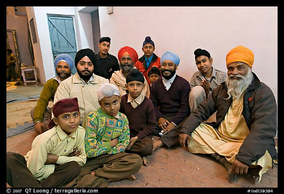 Sikh men and boys in gurdwara. Bharatpur, Rajasthan, India (color)