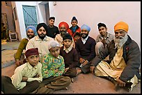 Sikh men and boys in gurdwara. Bharatpur, Rajasthan, India (color)