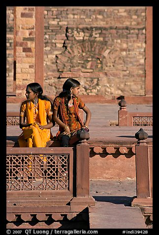 Young women sitting in the center of Ornamental pool. Fatehpur Sikri, Uttar Pradesh, India (color)